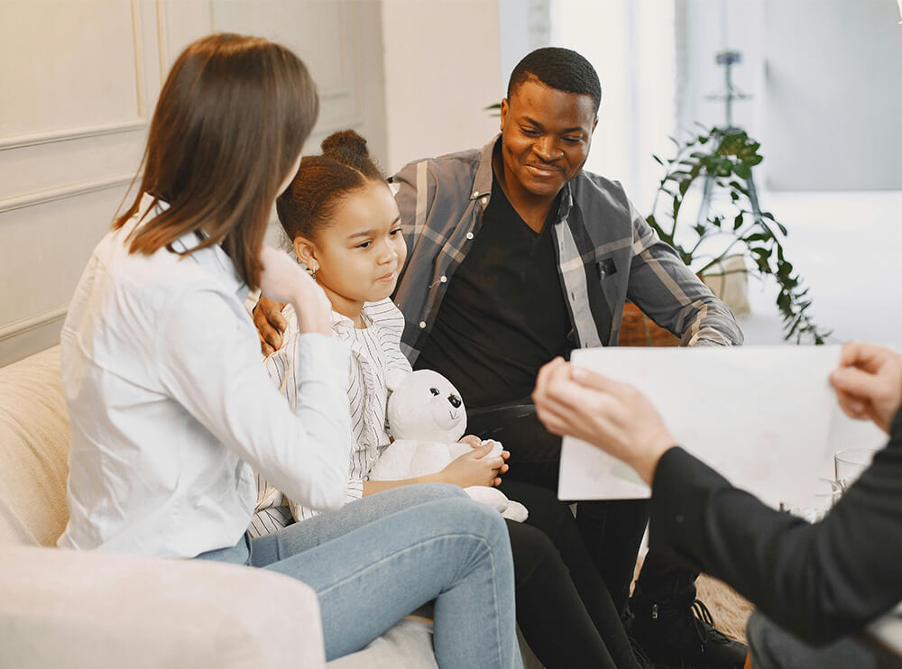Interracial couple with a child in family therapy