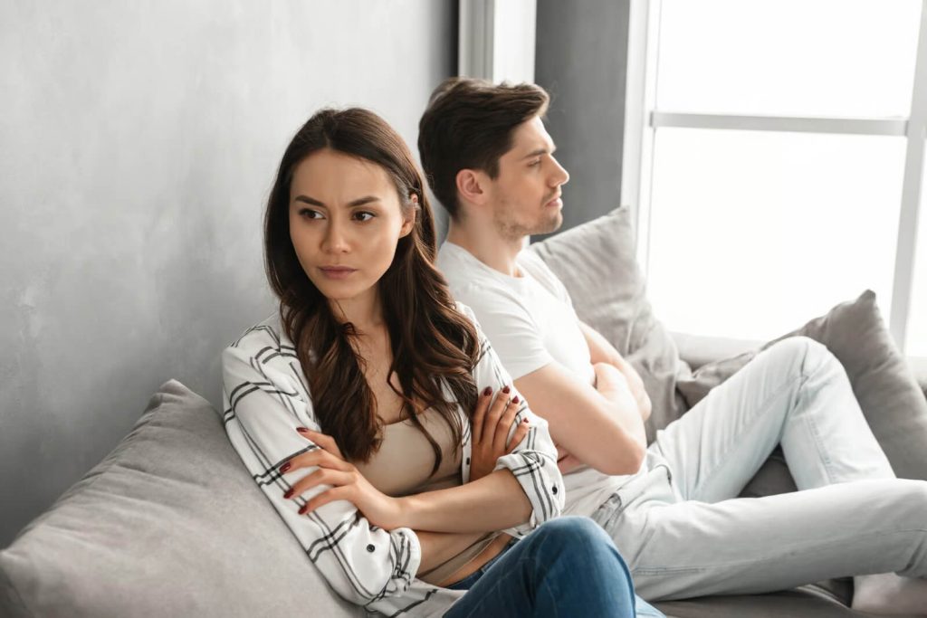 Young couple having arguments undergoing marital counseling